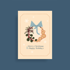 Christmas card with holiday wreath.